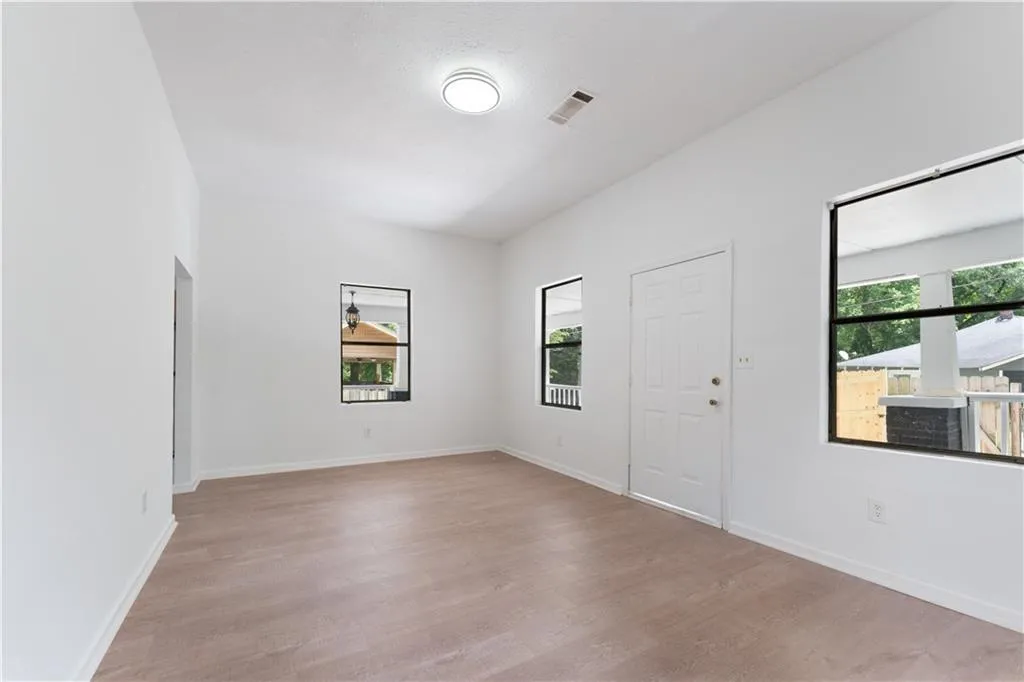 Foyer with healthy amount of natural light and light wood-style flooring