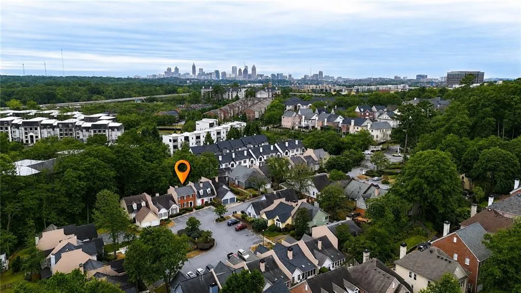 Aerial perspective showcasing a residential community with mature trees and varied architectural styles
