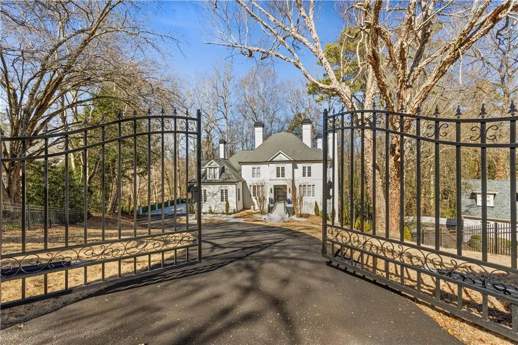 Gate featuring a fenced front yard