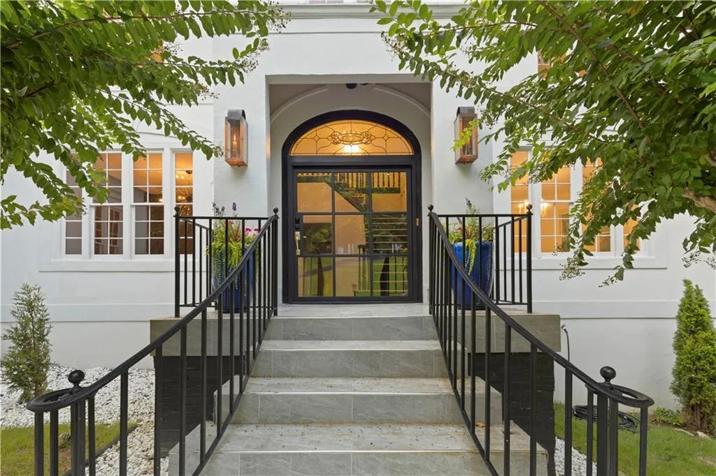 Doorway to property with stucco siding