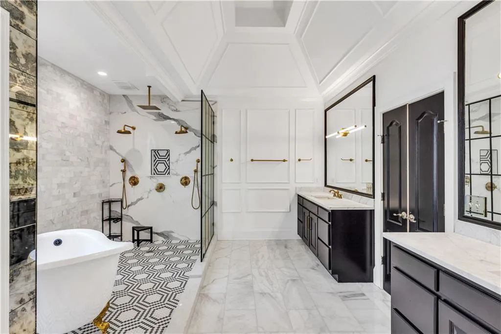 Full bath featuring vanity, a freestanding tub, ornamental molding, a shower stall, and coffered ceiling
