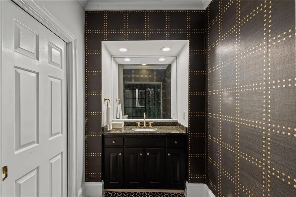 Full bathroom featuring vanity and a shower stall