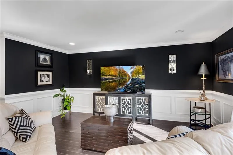 Living room featuring crown molding