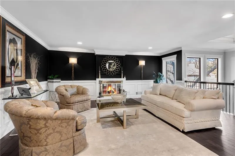 Living room with hardwood and ornamental molding
