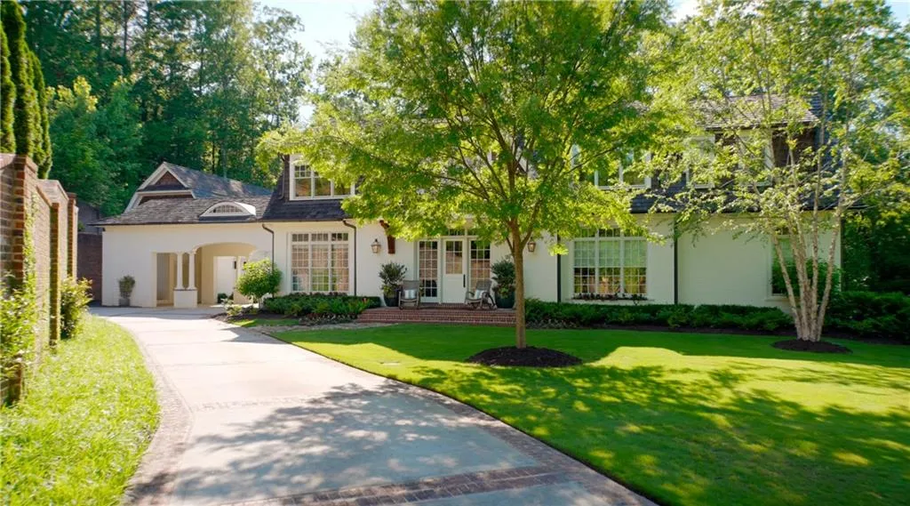 Nestled on over 3 acres in an executive four home community near Chastain Park.