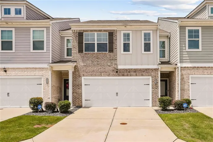 Brick and siding exterior with a two-car garage