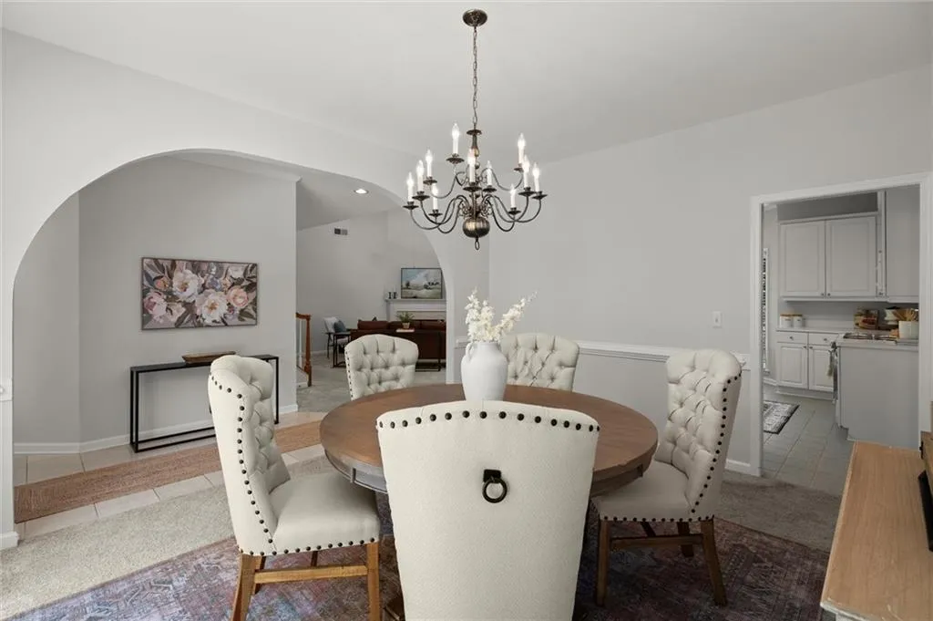 Just off the beautiful foyer is the spacious formal dining room. Notice the 