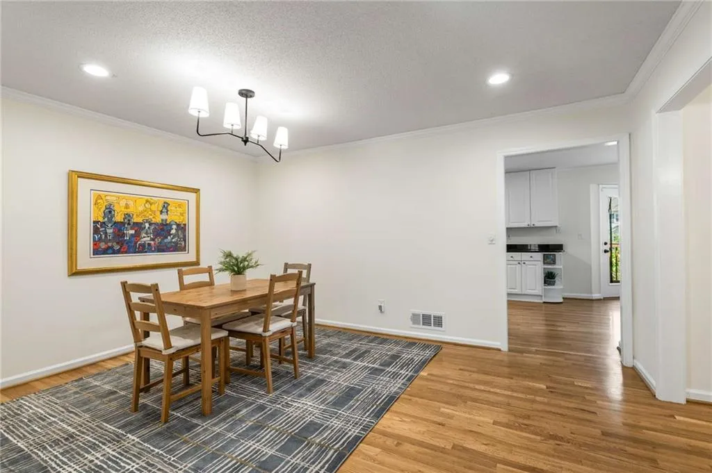 This dining space is locate between living and kitchen and is incredibly spacious.
