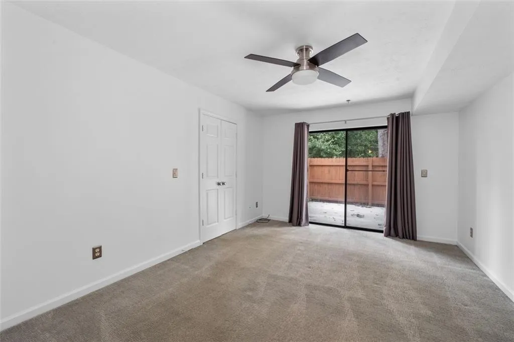 Owner's suite has easy access to the private patio via the sliding glass door.