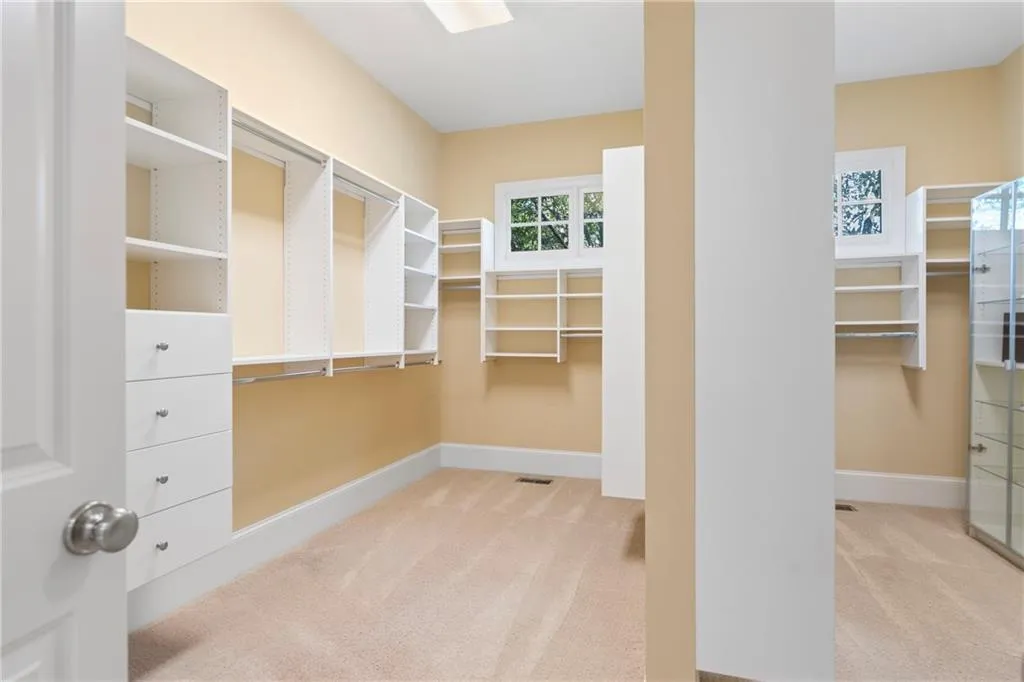 Walk in closet featuring carpet floors