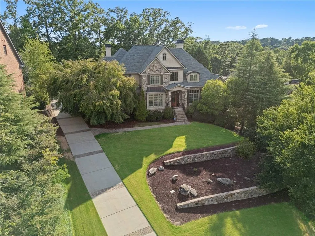 View from above of property with a heavily wooded area