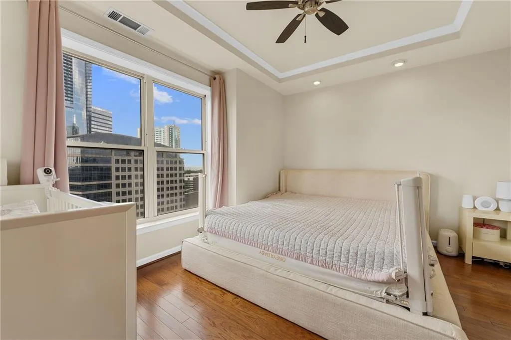 Tray ceiling with recessed lighting and a ceiling fan