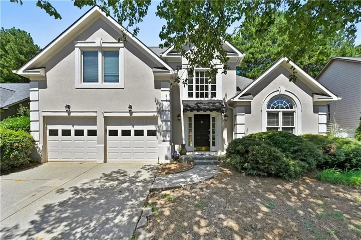 Stucco exterior with gabled roof lines