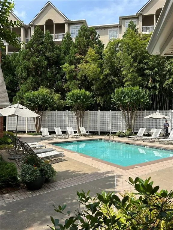 Community pool featuring a patio
