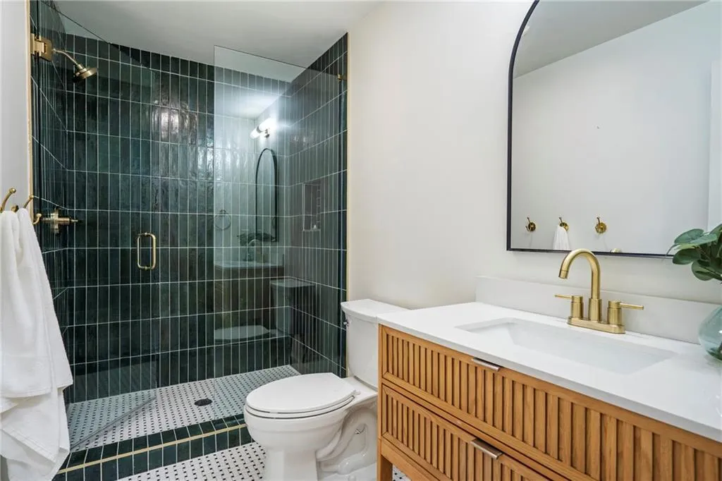 Basement bathroom that  covers all the needs on the lower level.