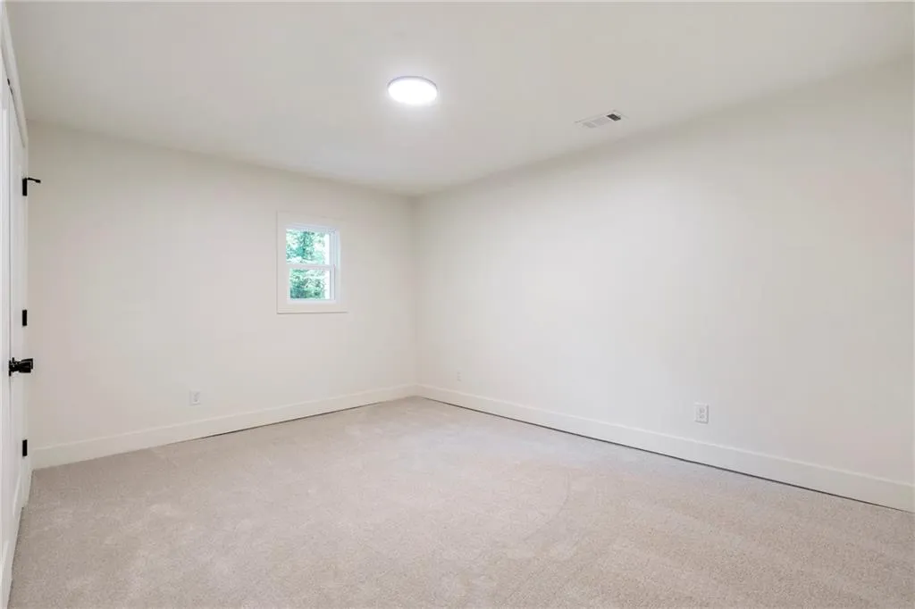 Basement Flex room. Could be utilize as an office, guest room, or playroom.