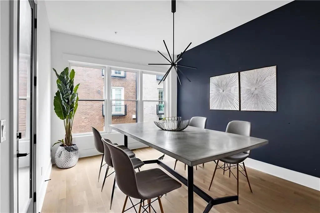 Dining area with light wood-style flooring and a chandelier
