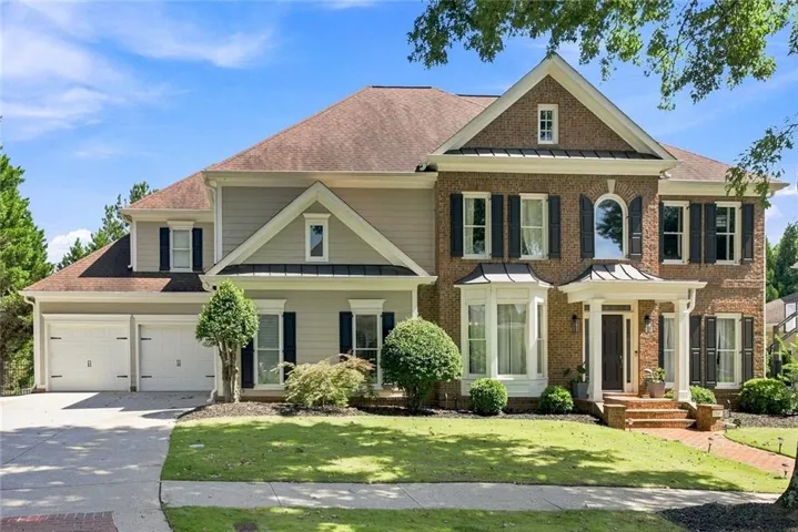 Brick and siding exterior with a multi-gabled roofline
