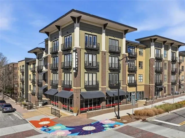 Contemporary mixed-use building featuring multi-story residential units above ground-level retail