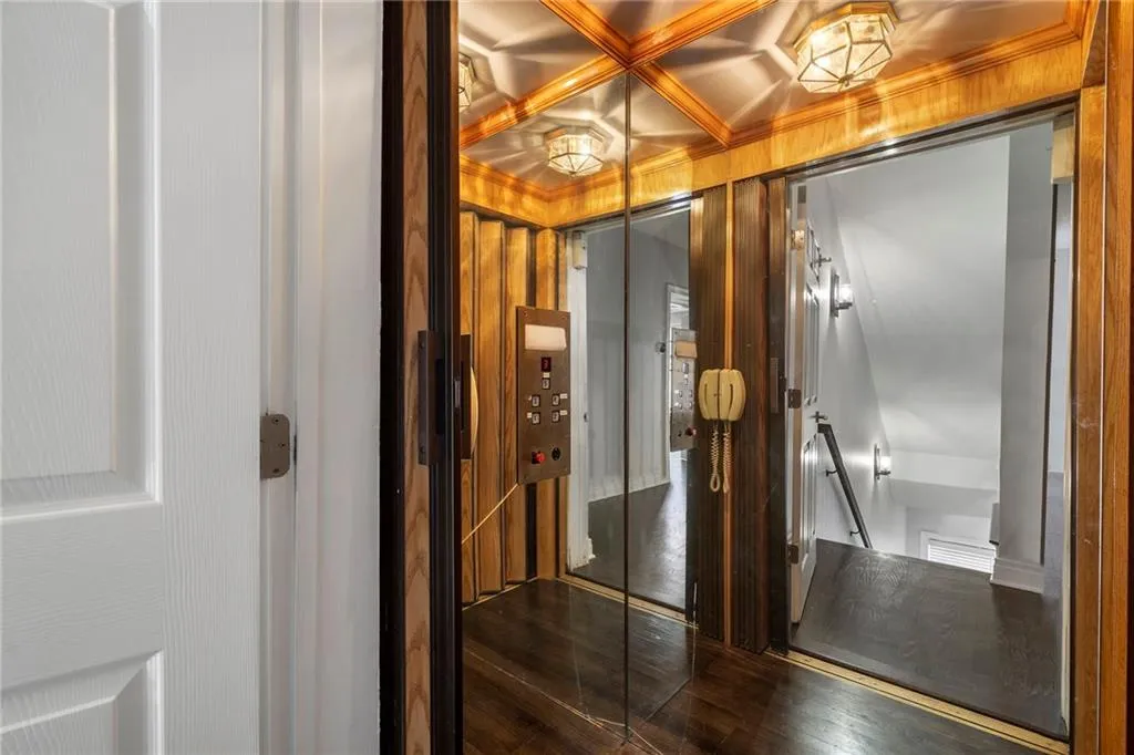 Bathroom with elevator, coffered ceiling, and beamed ceiling Bathroom with elevator, coffered ceiling, and beamed ceiling