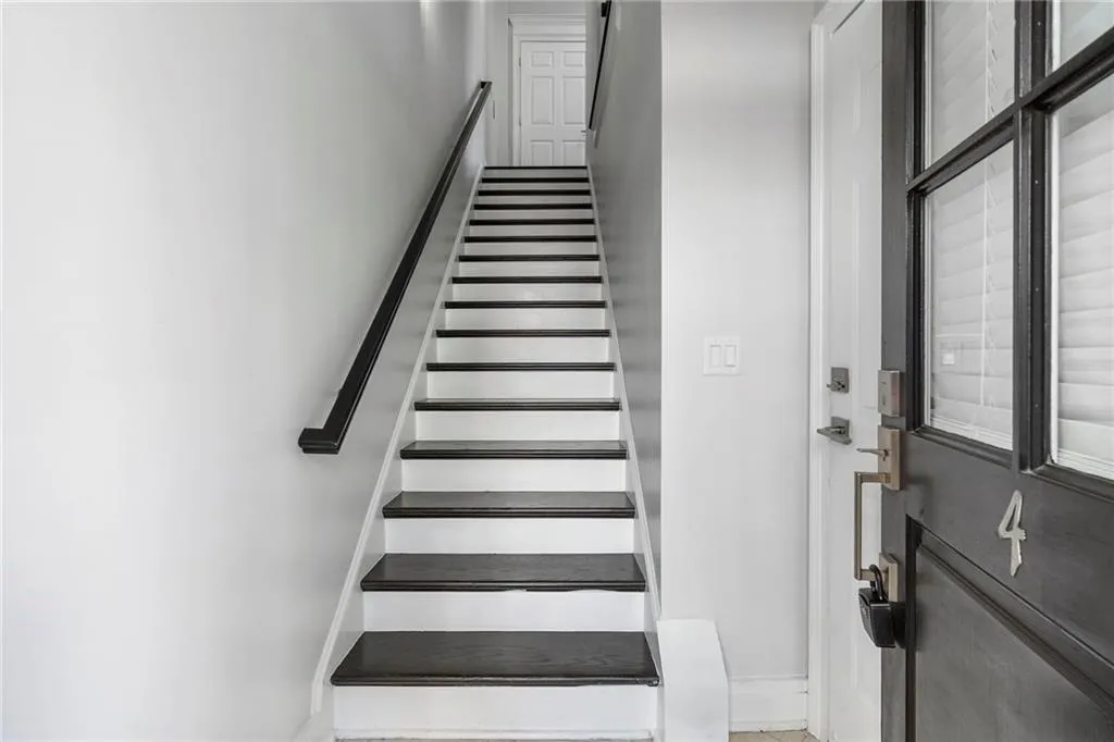 Stairway featuring baseboards Stairway featuring baseboards