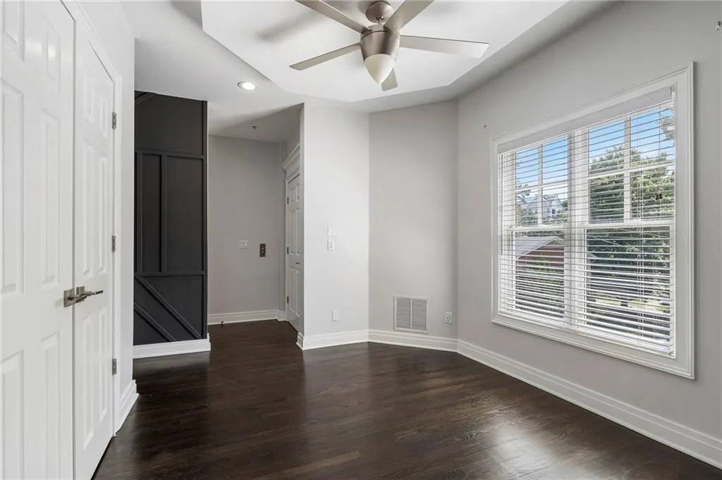 Spare room featuring recessed lighting, dark wood-style floors, and a ceiling fan Spare room featuring recessed lighting, dark wood-style floors, and a ceiling fan