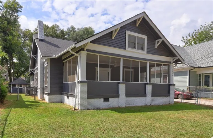 Beautiful Traditional Bungalow Upgraded with 4 BR, 2 BR, and 3 Bonus Rooms!