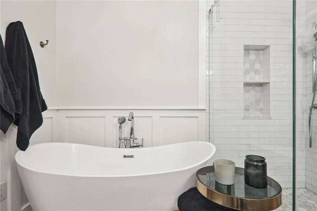 Bathroom featuring separate shower and tub