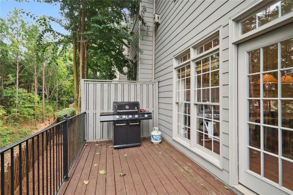 Wooden deck featuring grilling area