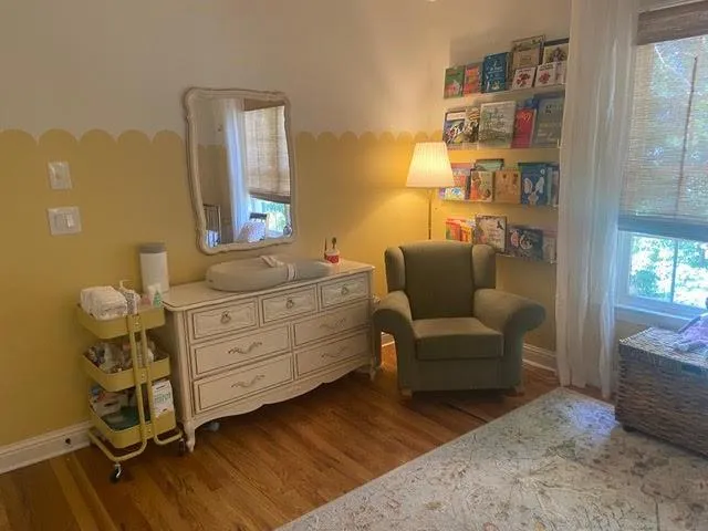 Sitting room with wood-type flooring
