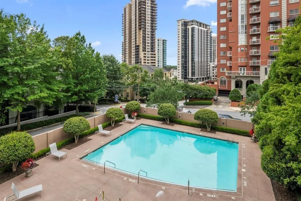 Community pool with a view of city