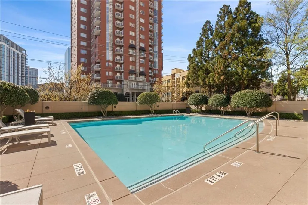 Community pool featuring fence