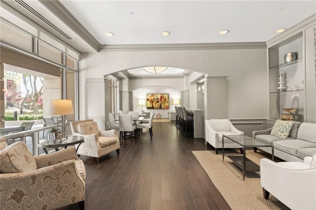 Common area with ornamental molding and recessed lighting