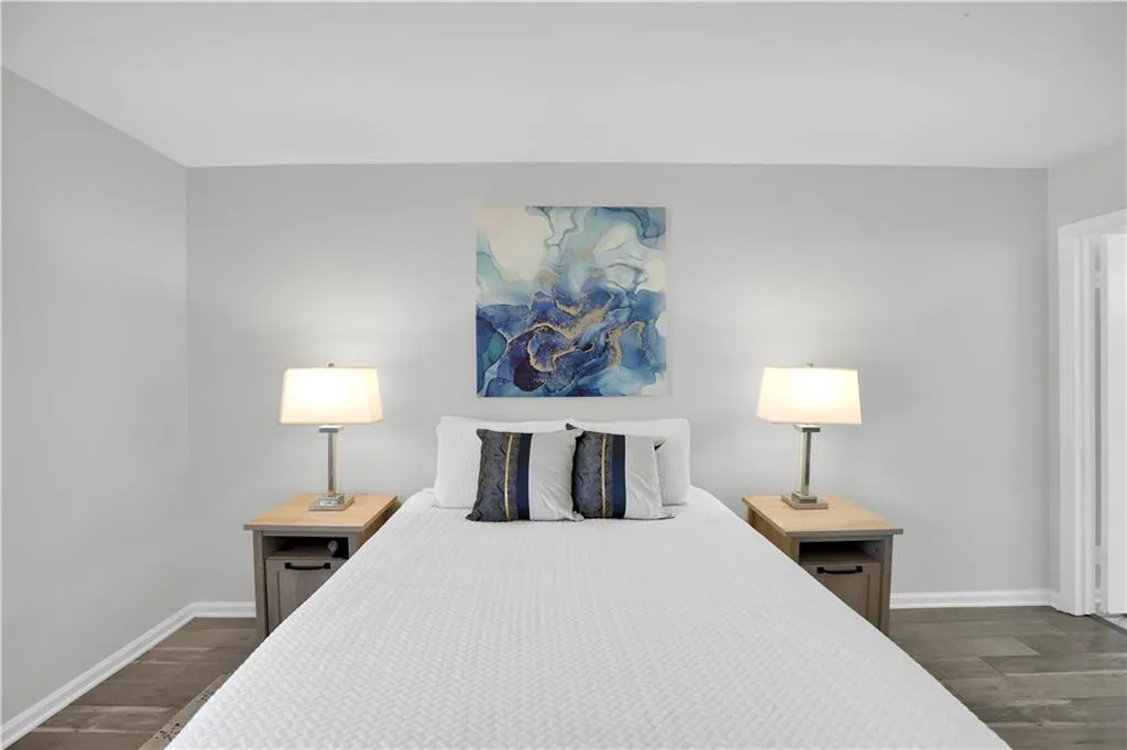 Bedroom with dark wood-type flooring