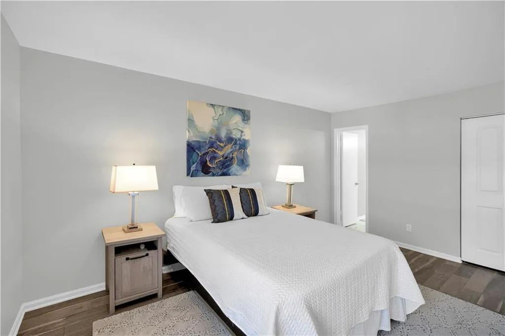 Bedroom with dark wood finished floors