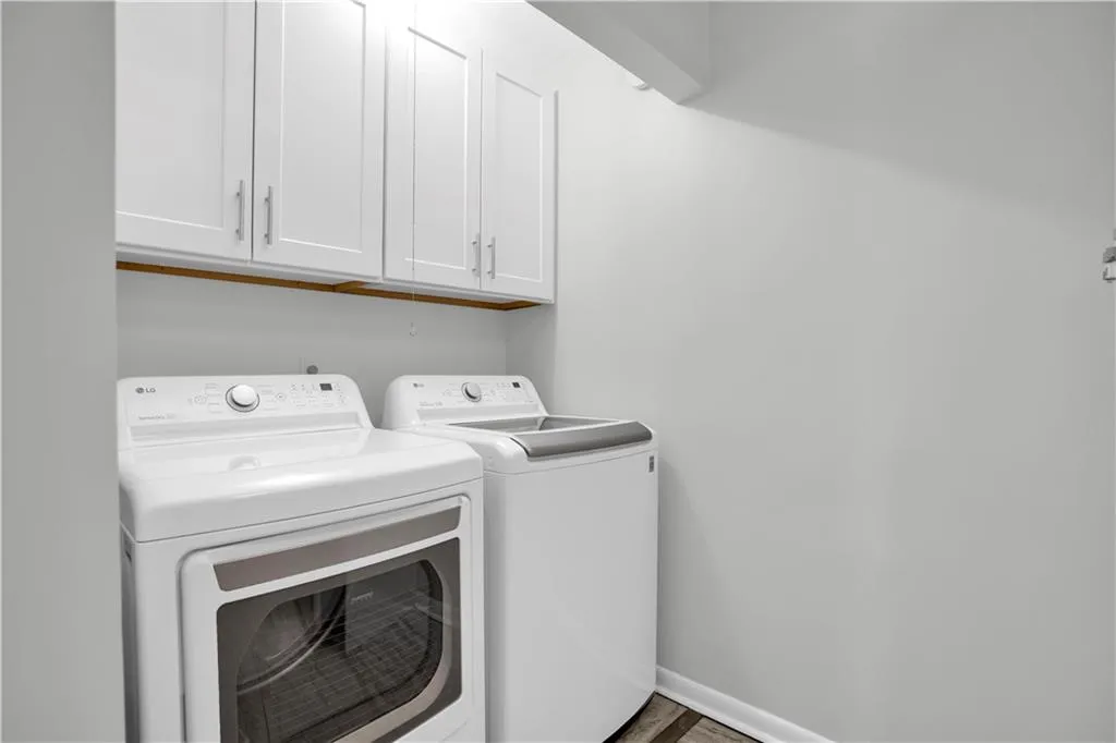 Laundry room featuring cabinet space and washing machine and dryer