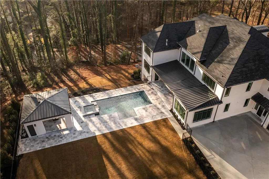 View of subject property with a pool area