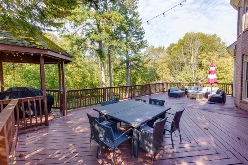 Expansive deck overlooking the large back yard