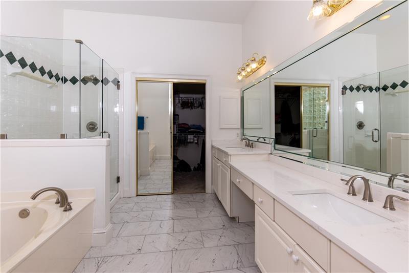 Primary bathroom with quartz counter tops