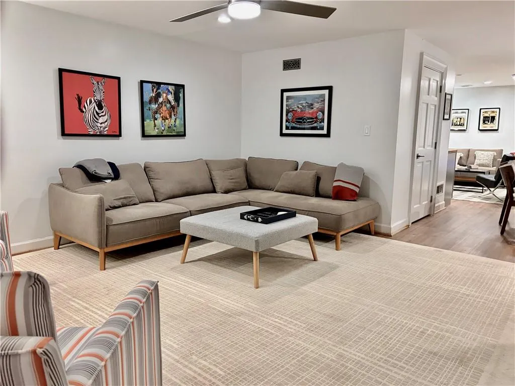 Recessed lighting, ceiling fan, and wood-finish flooring