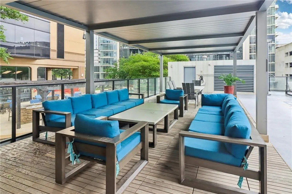 Wooden deck featuring an outdoor living space