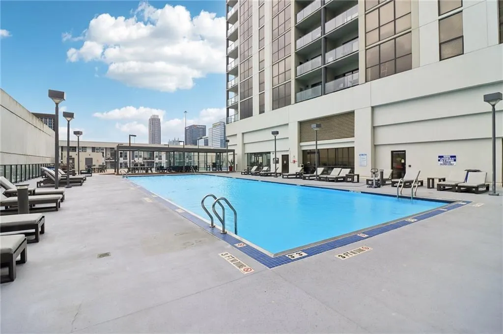 Community pool featuring a patio area