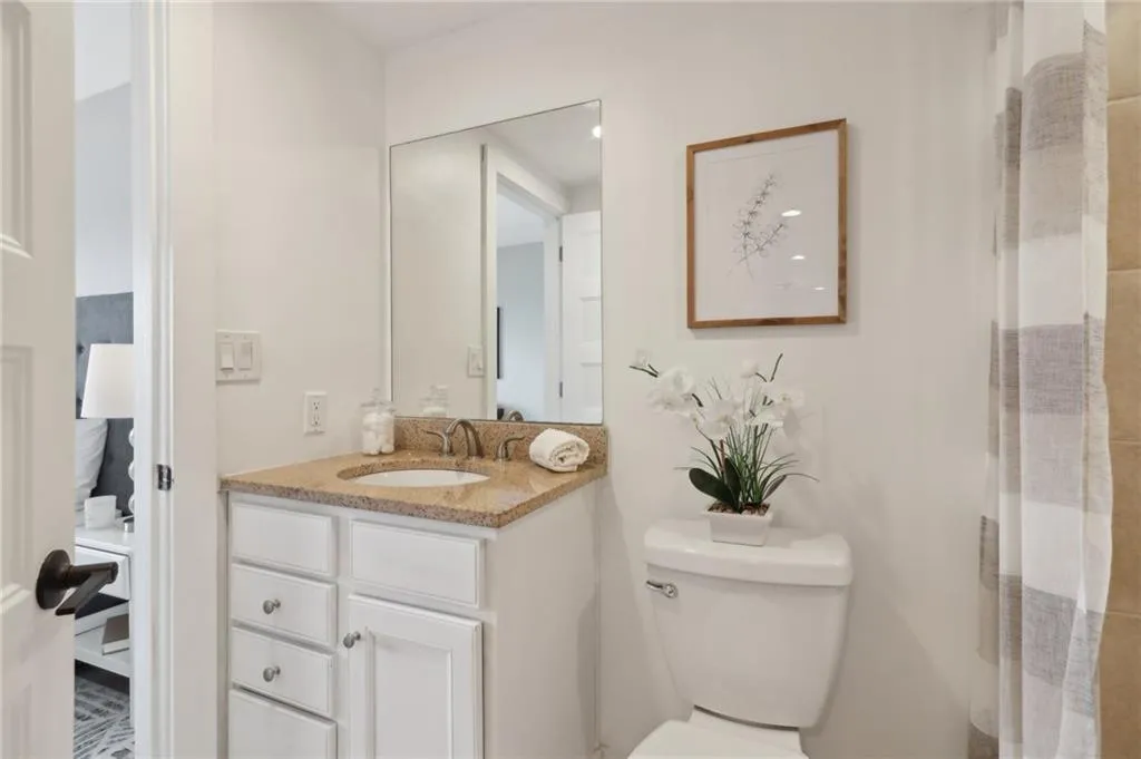 Bathroom featuring toilet and vanity