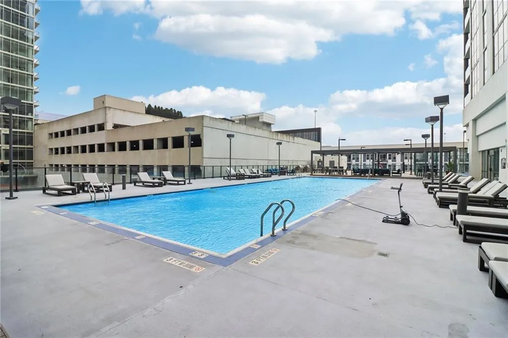 Community pool with a patio area