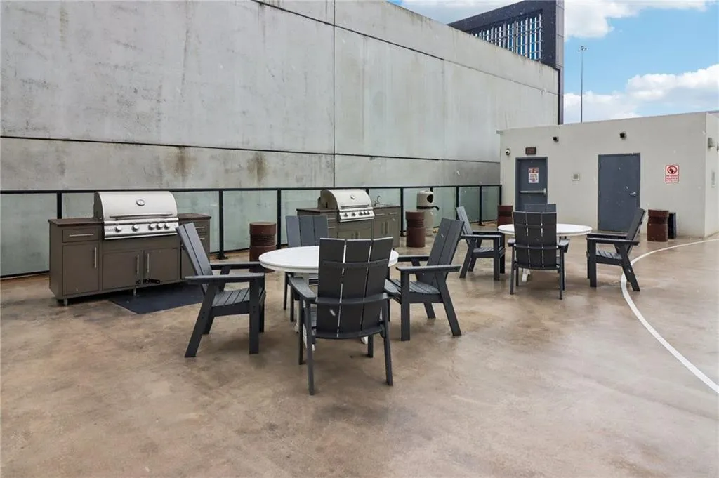 View of patio / terrace with grilling area and outdoor dining space