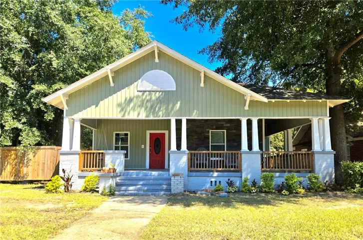 Craftsman inspired home featuring covered porch