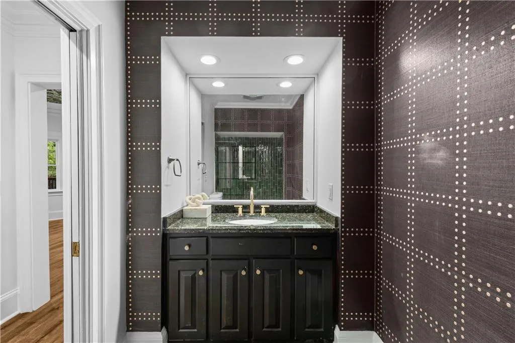 Full bath featuring vanity and wood finished floors