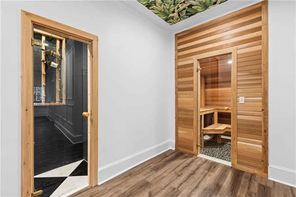 Sauna / steam room with wooden walls and wood finished floors