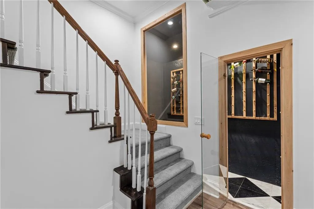 Stairs with ornamental molding and recessed lighting