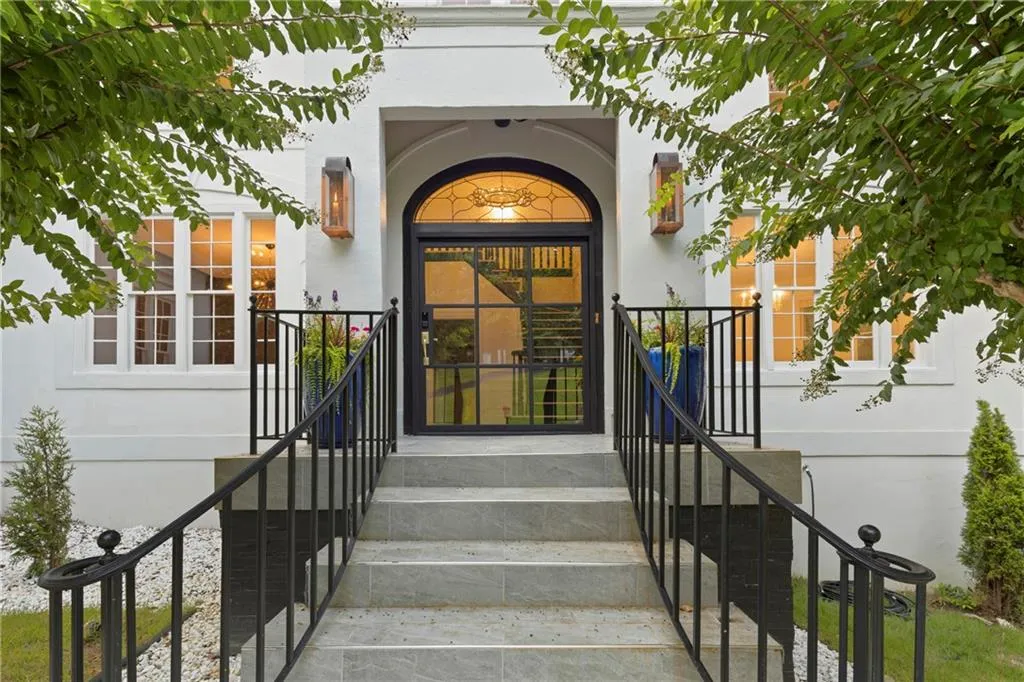 Property entrance featuring stucco siding